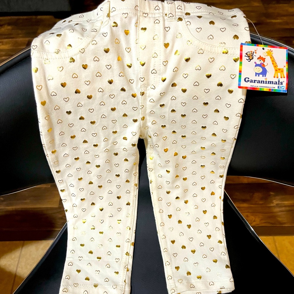 Brand new white jeans with gold hearts